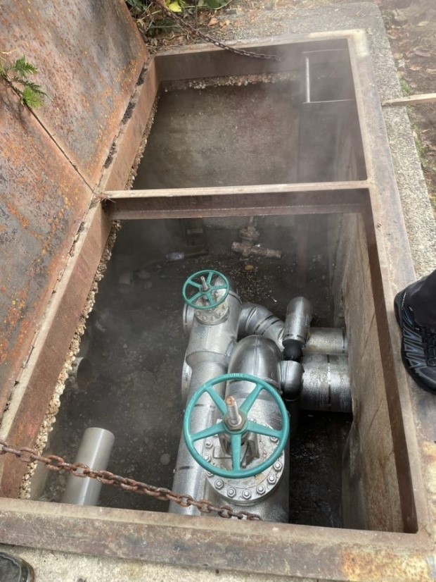 Service pit showing a segment of replaced line