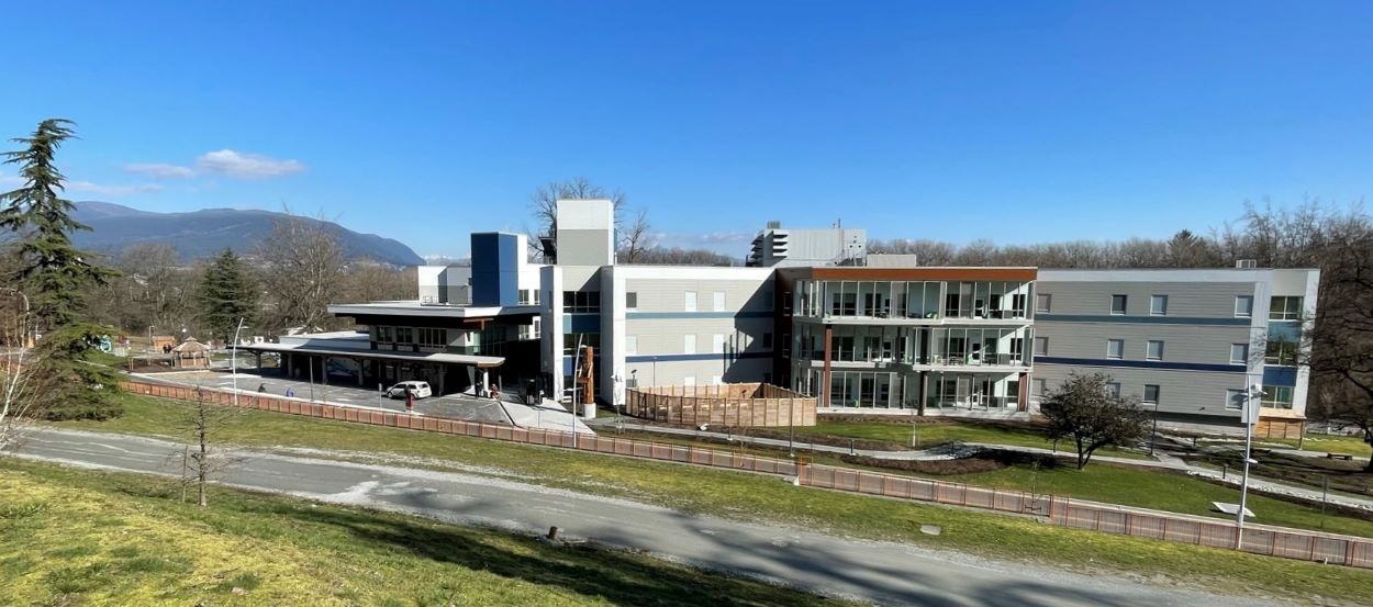 Downward view of a three story grey building